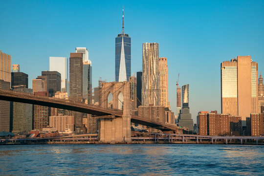 Title: 2022 Perfect blue sky view with Manhattan side tower of Brooklyn Bridge and downtown NYC skyline
