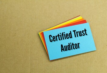 colored paper with the words Certified Trust Auditor