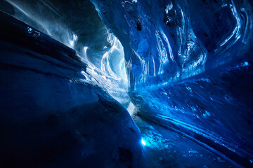 Landscape of amazing blue glacial ice cave