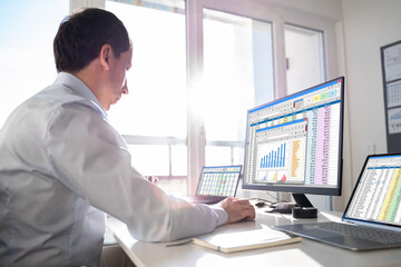 Analyst Working With Spreadsheet Business Data