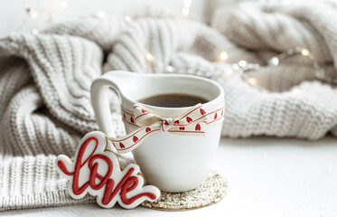 Festive composition with a cup and decor details for Valentine's Day.