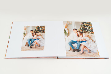 Photobook spread with photos of family photo shoot.