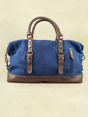 Men's blue travel bag on the table.