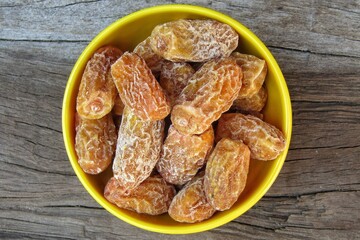 Dry dates in a bowl top view 