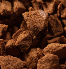 Instant coffee granules as background.