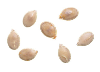 Close-up of pumpkin seeds on a white background.