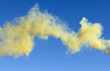 Yellow smoke on a blue background.