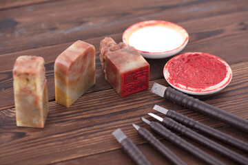 A large number of carving knives and carved seals