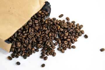 Close-up, coffee beans scattered from the package.