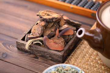 Chinese herbal rhubarb beside decoction casserole