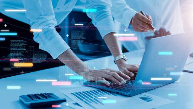 .Businessman working on marketing plan together and using laptop analyzing data of growth graph financial and investment for success, Teamwork, Business strategy and planning, Blue tone. - Powered by Adobe