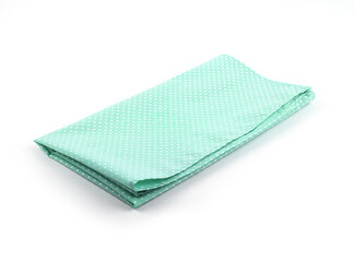 White small polka dot on green fabric or napkin isolated on white background. Concept kitchen utensils and tableware..