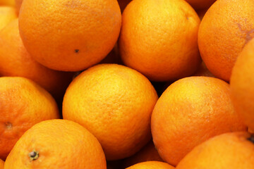 Obraz na płótnie Canvas Oranges on the shelfLots of oranges in the supermarket. Fruit photo.