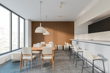 Bright cafe interior with panoramic window with town view