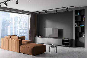 Dark living room interior with sofa, tv, panoramic window