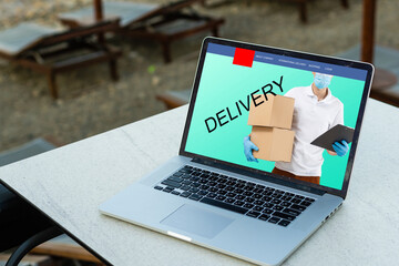 Online shopping. laptop with banner delivery