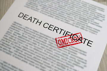 Red omicron seal standing on death certificate document closeup