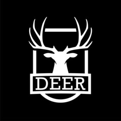 Head of deer on shield icon isolated on dark background