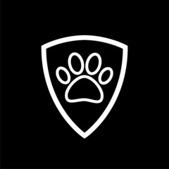 Paw and shield  icon isolated on dark background