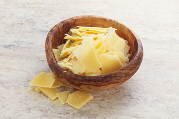 Sliced parmesan cheese heap in the bowl