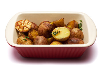 Baked potato in baking dish isolated on white background