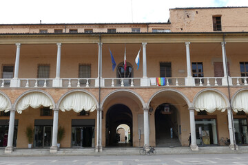the portico of the goldsmiths in piazza del popolo in Faenza with columns in yellow Varignana's stone