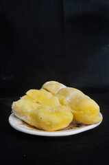 fermented cassava on a black background