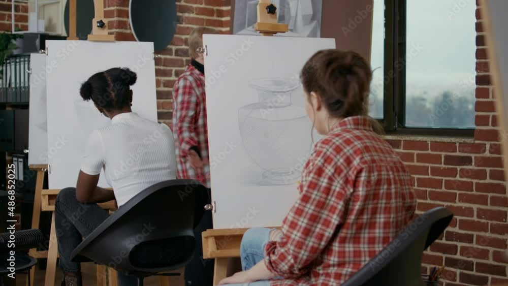 Poster artist creating vase drawing on canvas and easel, attending art class to develop artistic skills. st