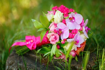 Beautiful, bright, saturated with colors bridal bouquet of various flowers. Wedding, Husband and wife, happy together, marriage, just married, wedding rings, flowers, decor, bouquet, peonies, roses.