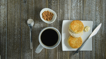 Slices of biscuits with butter. Hot Coffee with brown sugar