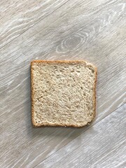 bread and wheat. sliced whole wheat isolated on the floor. 