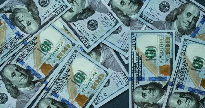 Background with many American one hundred dollar bills. Looped stop motion animation