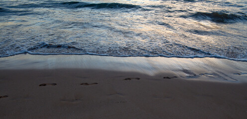 Tropical beach background. Sandy beach with calm wave of turquoise ocean. Maldives, perfect scenery landscape, copy space.