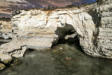 Coast of island of Otranto, Puglia, Salento, Italy. Turquoise sea, clear blue sky, rocks, sun,...