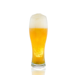 light beer in a glass glass with thick white foam. white background.