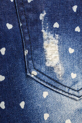 Small heart blue jeans texture background.