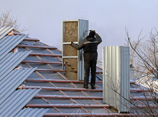 Repair pipe on the roof of an apartment building