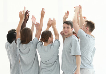 in full growth. group of young people standing in a circle with