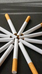 cigarettes placed on a pile 