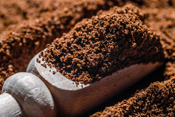 Aromatic ground coffee in spoon