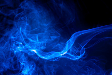 Blue smoke on black background.