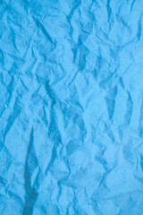 Blue crumpled paper background.