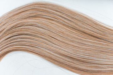 Wigs, natural and synthetic hair. Women's beauty concept. Close up photo of wig, hair for ladies