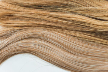 Wigs, natural and synthetic hair. Women's beauty concept. Close up photo of wig, hair for ladies