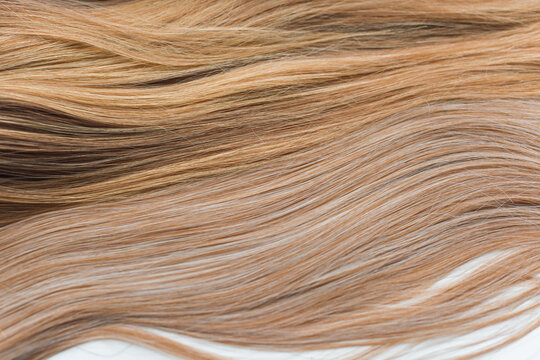 Wigs, natural and synthetic hair. Women's beauty concept. Close up photo of wig, hair for ladies