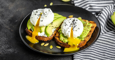 Sandwiches with avocado and poached egg. Healthy food, keto diet, diet lunch concept. Top view - obrazy, fototapety, plakaty
