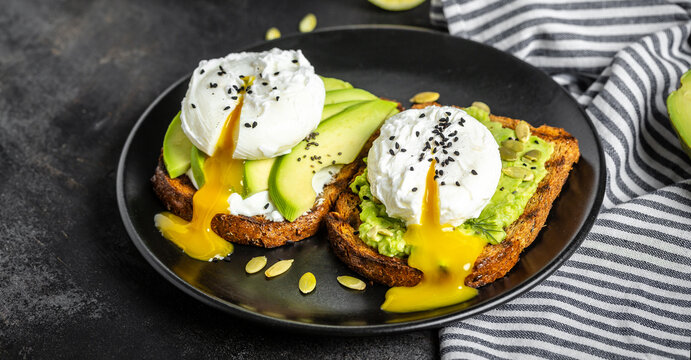 Sandwiches with avocado and poached egg. Healthy food, keto diet, diet lunch concept. Top view