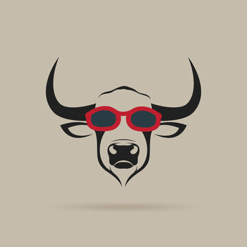 Vector of bull head wearing red sunglasses on brown background. Wild Animals. Animal fashion. Easy editable layered vector illustration.