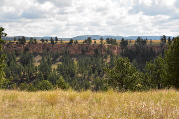 Obraz premium Cloud Covered Skies Over a Canyon in the Summer