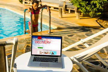 delivery icon on laptop keyboard. Online shopping, ecommerce and retail sale concept, delivery for customers ordering things from retailers websites using internet